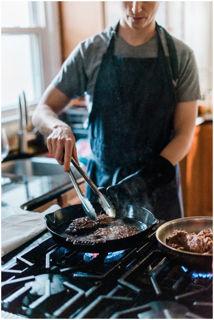 Carne Asada Skirt Steak cooking in a cast iron pan